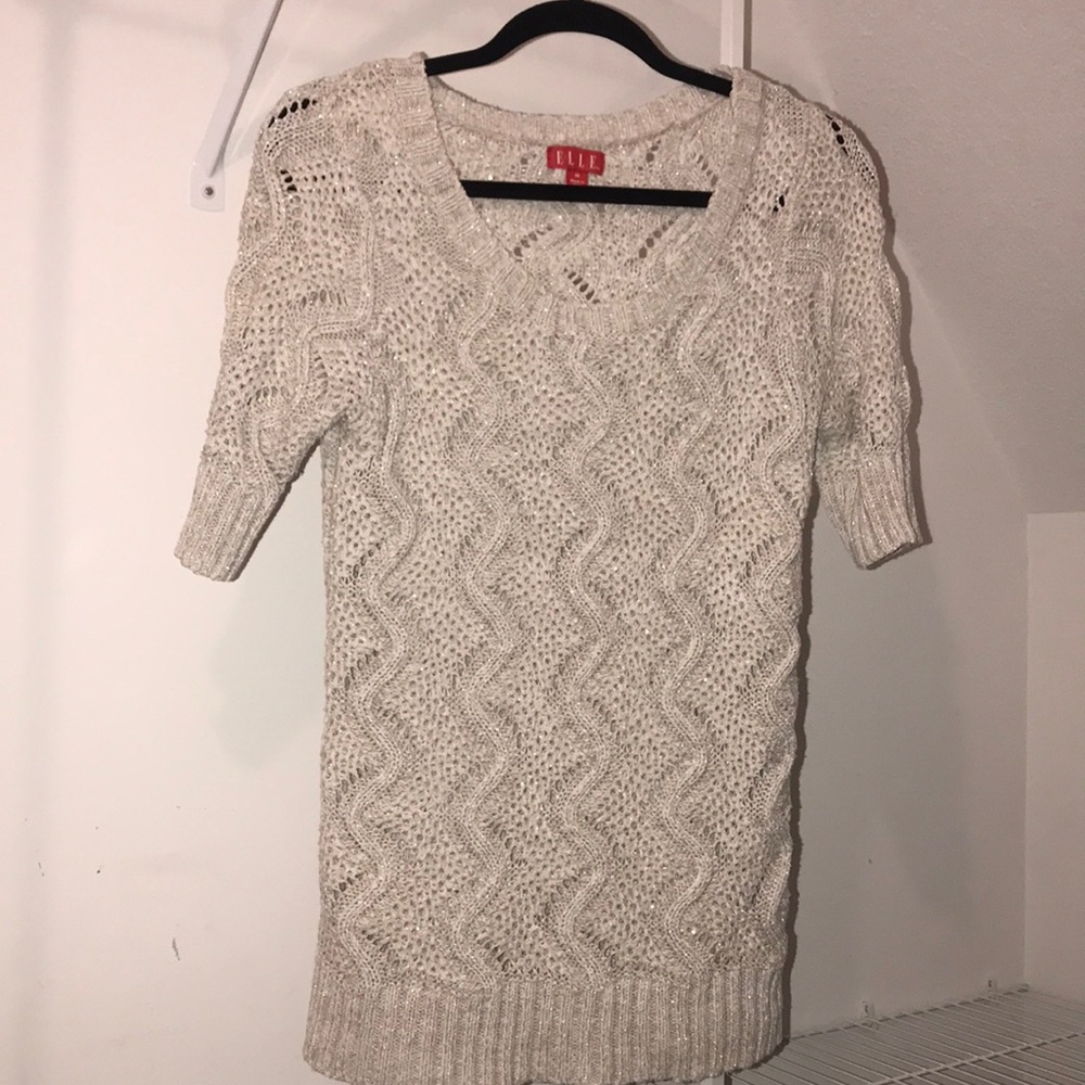 Beige sweater with light metallic accents